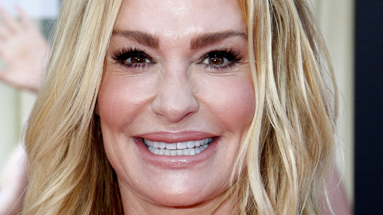 Taylor Armstrong grinning long eyelashes pink lip