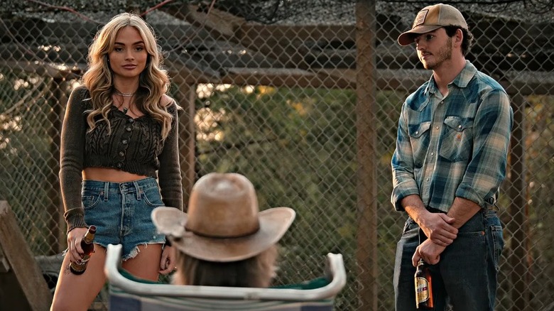 Carter and Oreana holding beer bottles on Dutton Ranch.