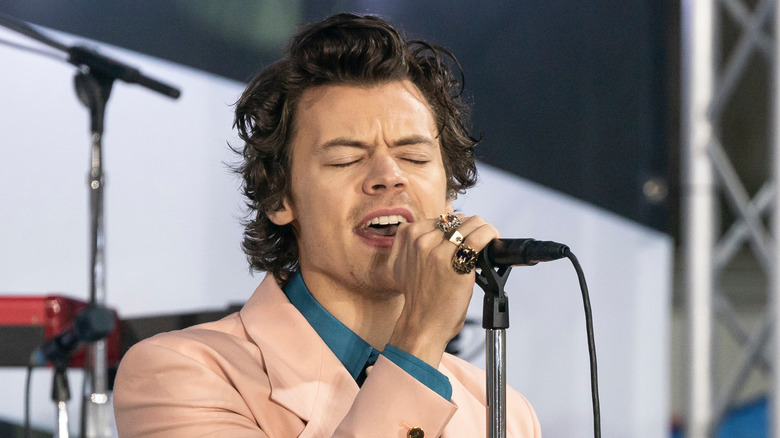 Harry Styles in peach suit on stage