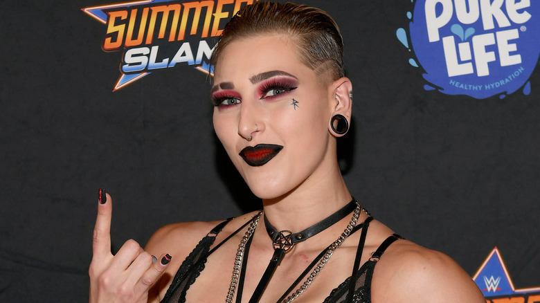 Rhea Ripley flashing the horns