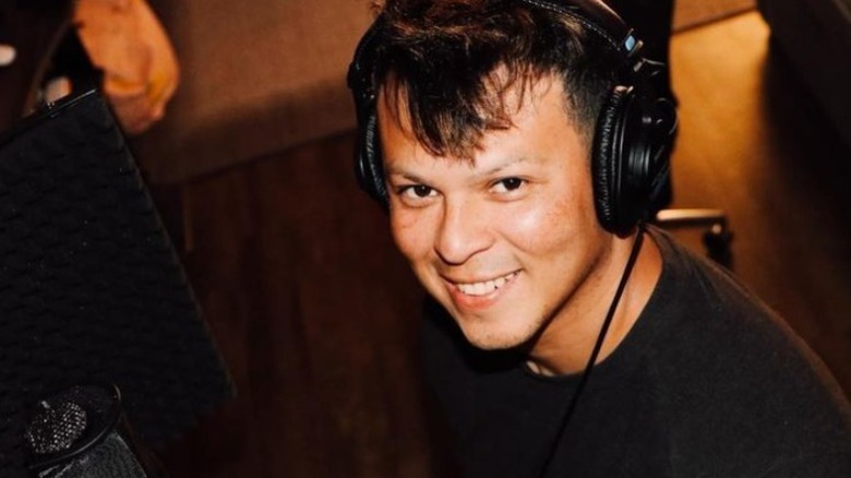 Yamir Castillo smiling and making music 