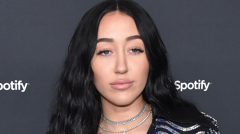 Noah Cyrus looking away