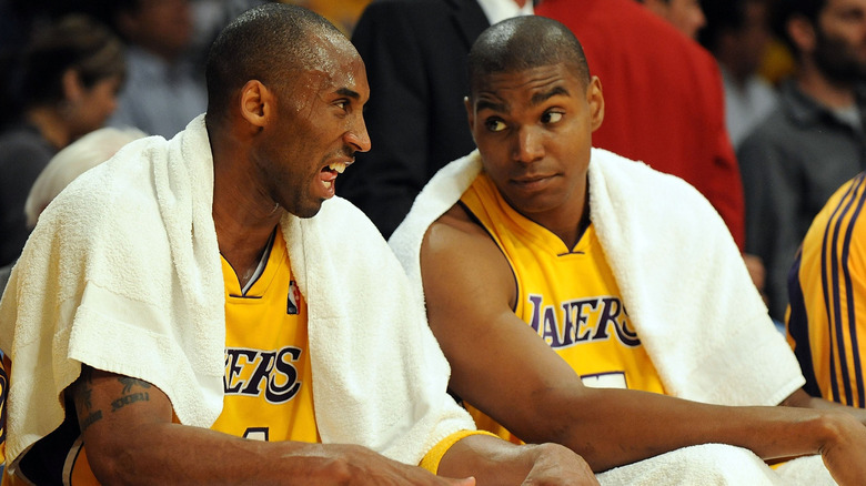Kobe Bryant and Andrew Bynum, sitting next to each other on the sidelines