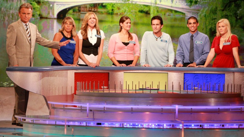 Pat Sajak greets Nancy Kaufman, actress Paige Hemmis, Susan Moran, actor Jeff Probst, Nick Giovine and actress Alison Sweeney during a taping of "Wheel Of Fortune Celebrity Week" 