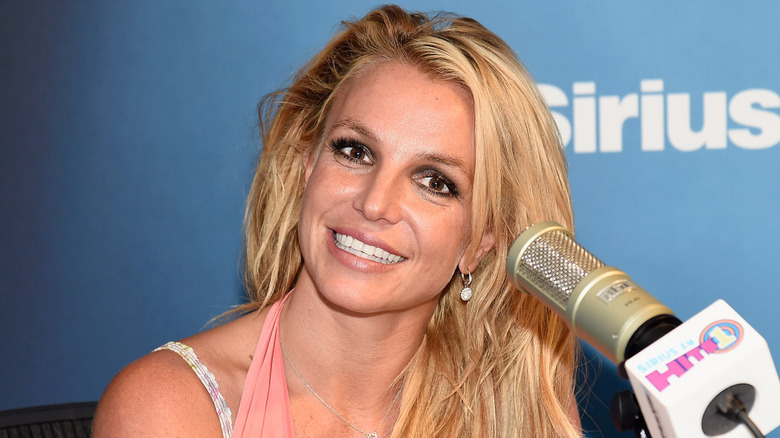 Britney Spears smiling with microphone