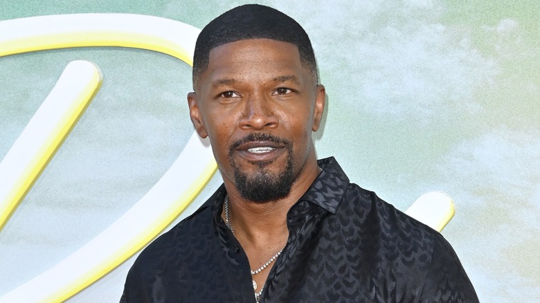 Jamie Foxx wearing black dress shirt