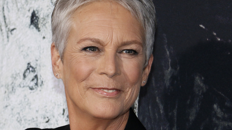 Jamie Curtis smiling at a 2018 movie premiere 