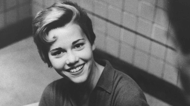 Jane Fonda smiles in a black and white photo