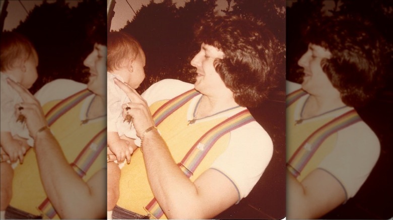 Baby Bunnie Xo held by her father