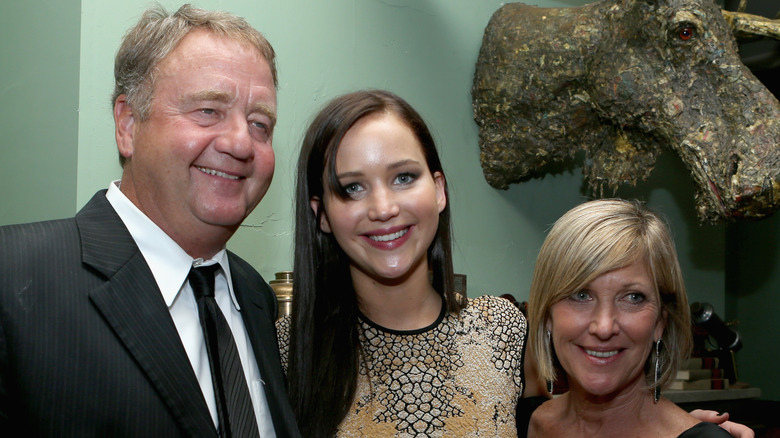 Gary Lawrence, Jennifer Lawrence, and Karen Lawrence smiling and posing together