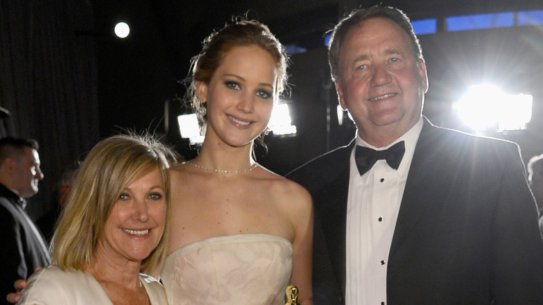 Karen Lawrence, Jennifer Lawrence, and Gary Lawrence posing at the Oscars