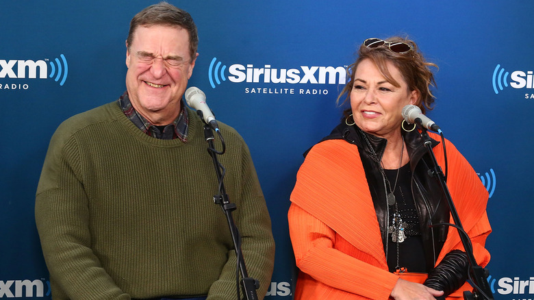 John Goodman and Roseanne Barr laughing