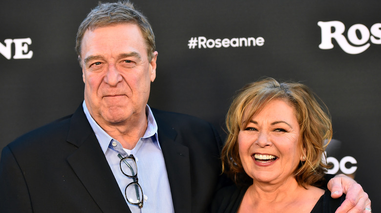 John Goodman and Roseanne Barr smiling