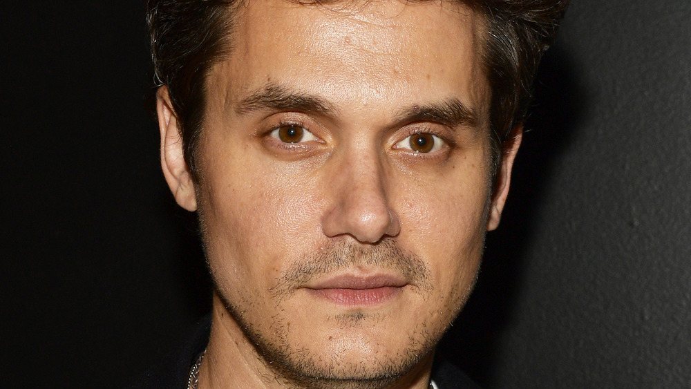 John Mayer staring at camera