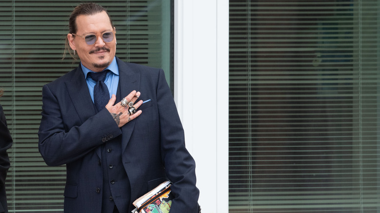 Johnny Depp hand over heart