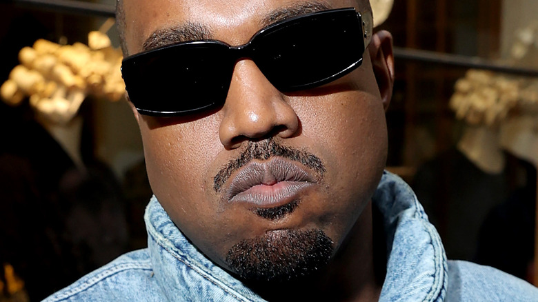 Kanye West wears sunglasses