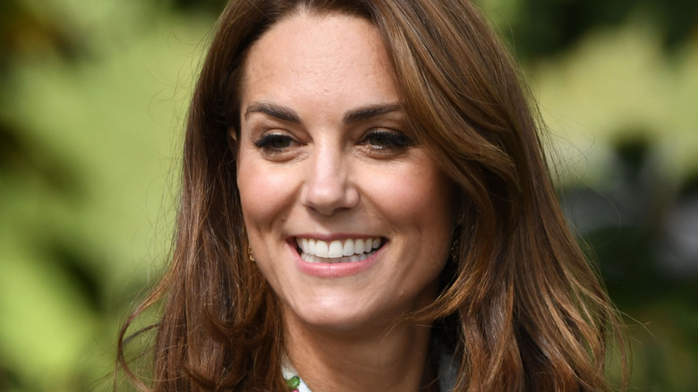 Kate Middleton smiles at an event