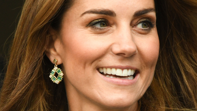 Kate Middleton wears green dangle earrings