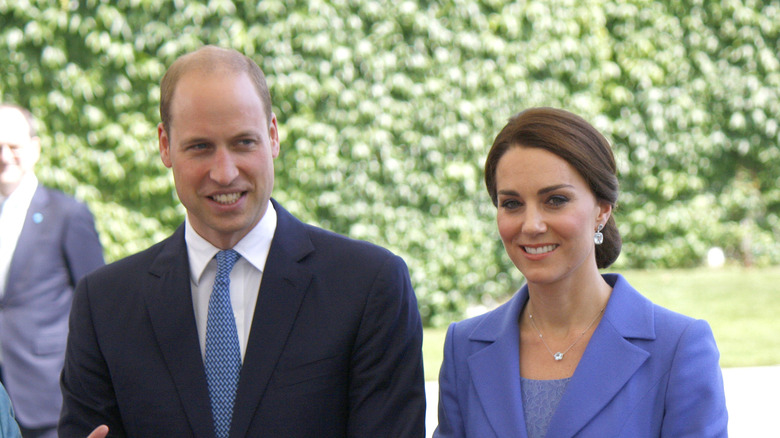 Prince William and Kate pose outdoors