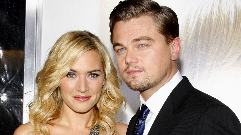 Leonardo DiCaprio and Kate Winslet embracing in a theater