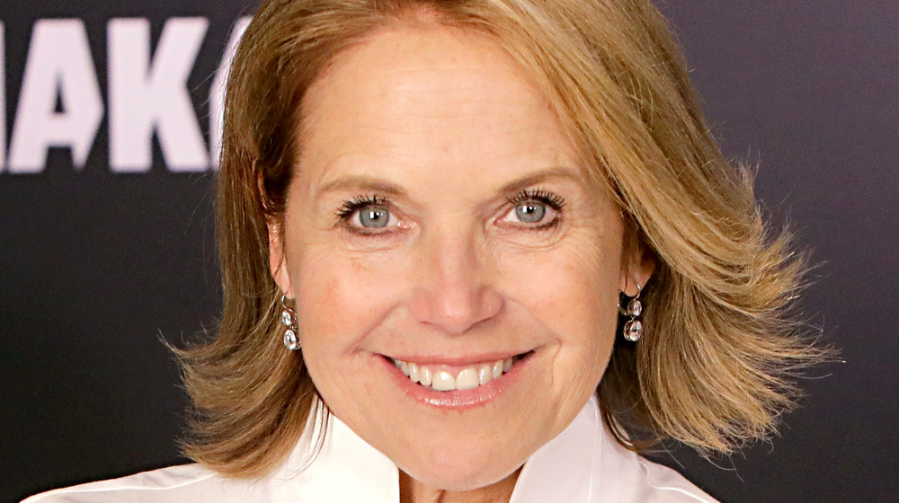 Katie Couric looking straight into the camera and smiling 