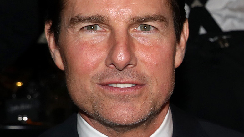 Tom Cruise looking at camera with slight smile