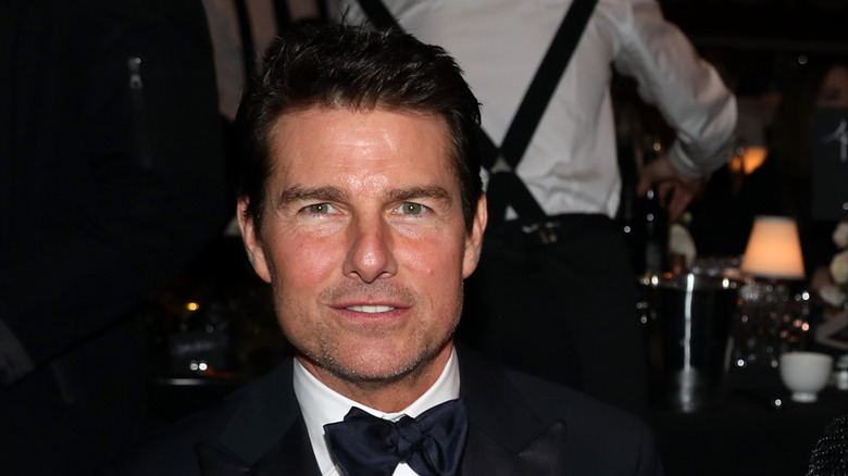 Tom Cruise looking at camera with slight smile