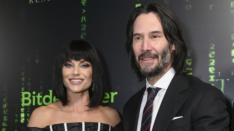 Ellen Hollman and Keanu Reeves smiling