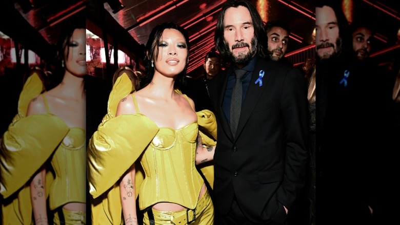 Rina Sawayama and Keanu Reeves posing