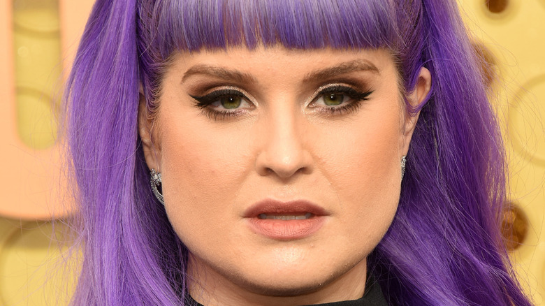 Kelly Osbourne posing