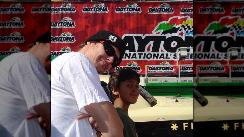 Kid Rock posing with his young son