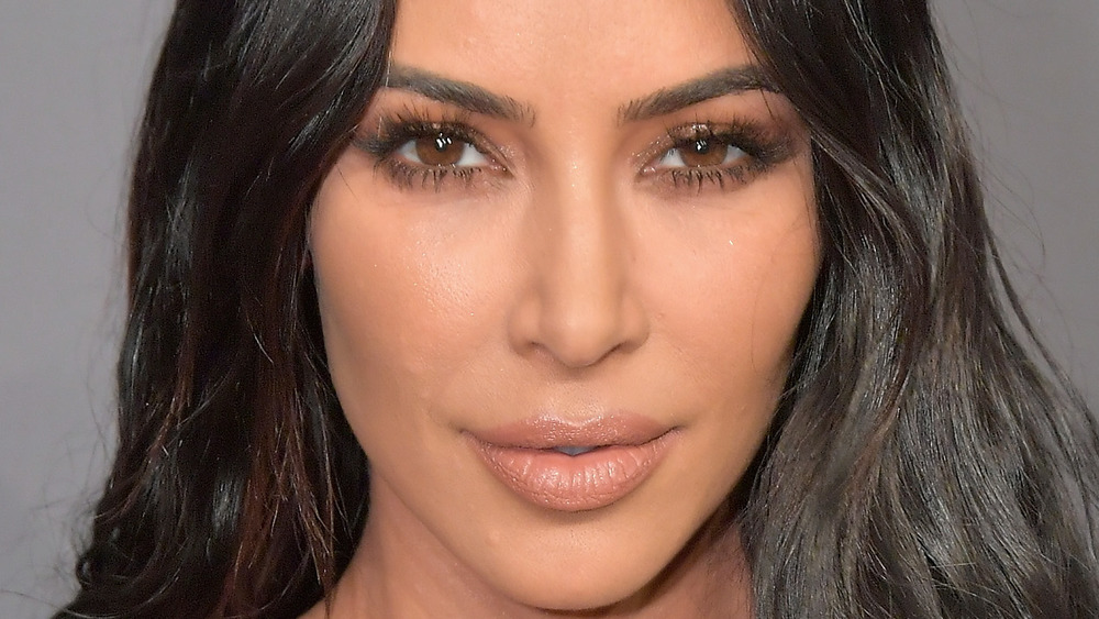 Kim Kardashian smirking