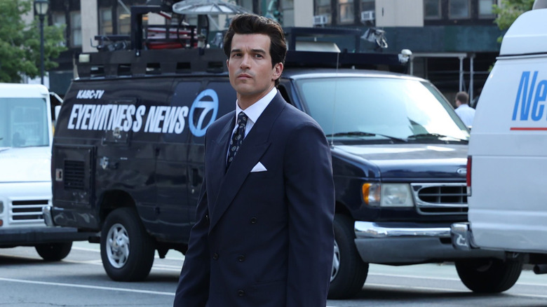Paul Anthony Kelly in character in a suit as John F. Kennedy Jr