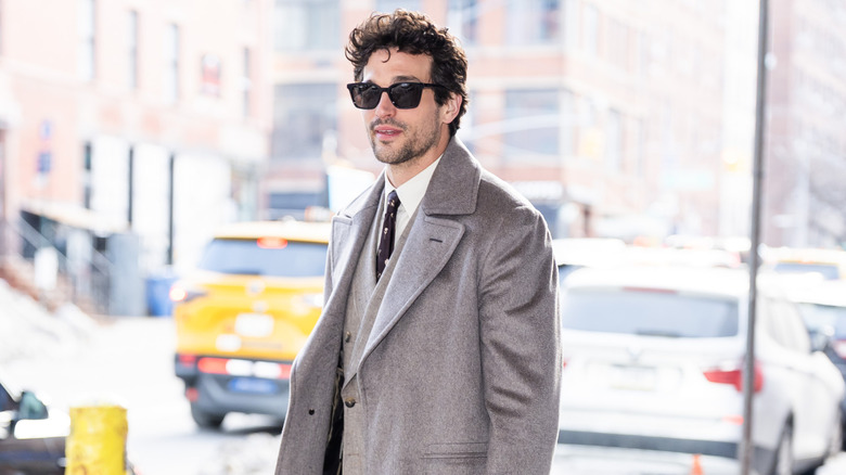 Paul Anthony Kelly walking streets of New York City in sunglasses