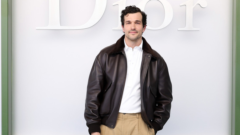 Paul Anthony Kelly attends Dior show in leather jacket