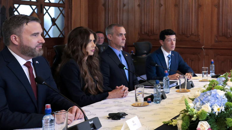Kristi Noem sits next to Corey Lewandowski during visit to Central America in June 2025