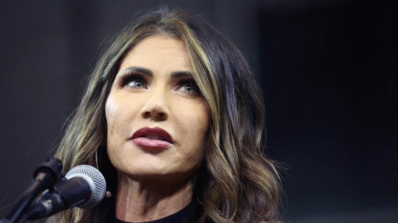 Kristi Noem speaks into mic during 2023 event