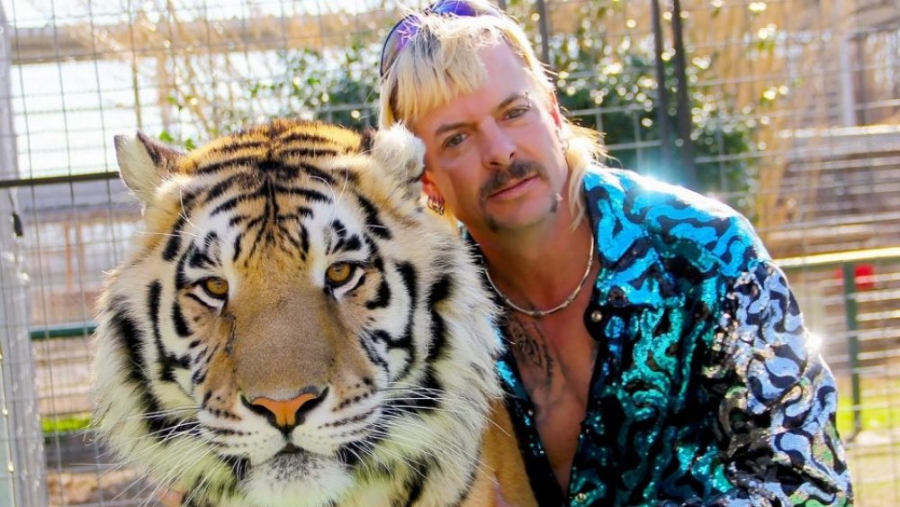 Joe Exotic posing with a tiger