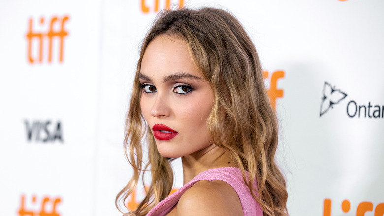 Lily-Rose Depp poses in red lipstick