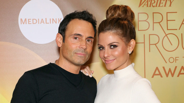 Maria Menounos with hand on Keven Underago's shoulder