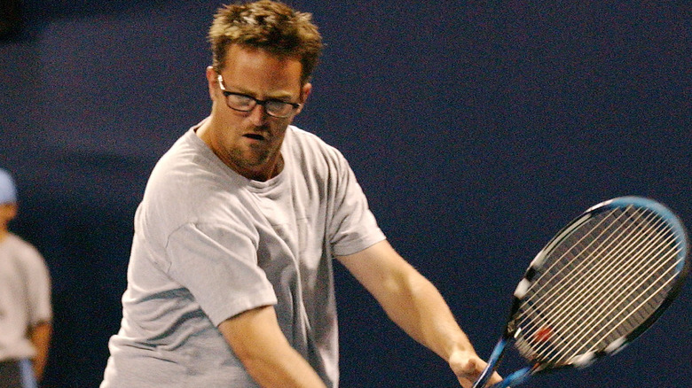Matthew Perry playing tennis
