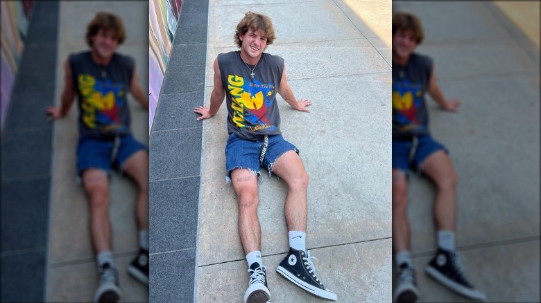 MattyBRaps lounging on concrete in 2022