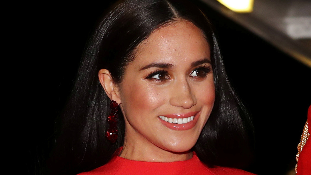 Meghan Markle smiles during a public outing