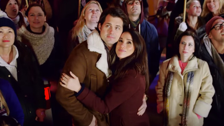 Kristoffer Polaha and Meghan Markle embracing