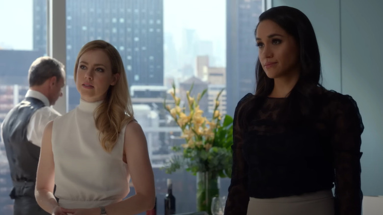 Amanda Schull and Meghan Markle with skyscraper in background