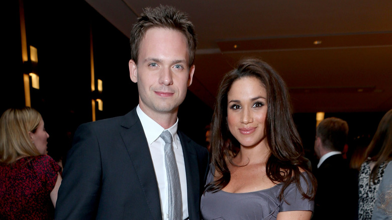 Patrick J. Adams and Meghan Markle posing