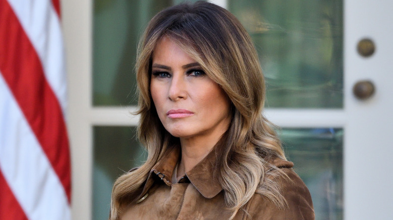 Melania Trump wearing brown jacket