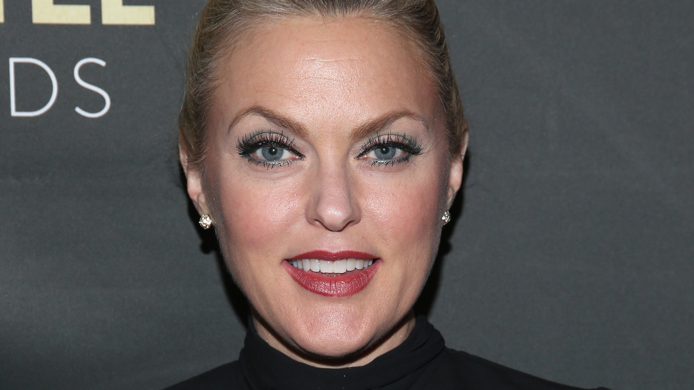 Elaine Hendrix's smiling on the red carpet