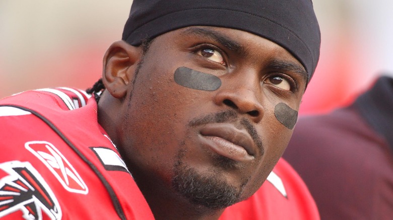 Michael Vick staring upwards in falcons NFL uniform