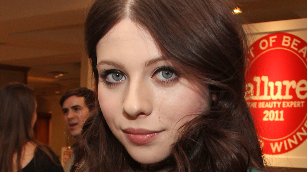 Michelle Trachtenberg looking at camera